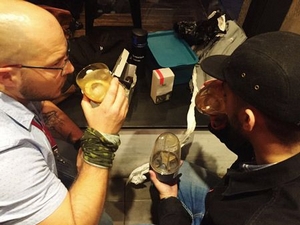 Craig and Winston taste coffee extraction.
