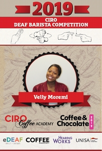 Velly is known for her smile and bubbling personality.  Customers at Saxby SPAR Beantree visit to specifically see her.  Velly serves coffee and assist in the deli and fresh line counter.  She enjoys preparing the BAR ONE Hot chocolate for customers with a shot of espresso - as she decorates it with cream and marshmallows and this makes her heart feel full and happy.  Velly loves travelling with friends and is competing in the Ciro Deaf Barista Competition for the third time this year.